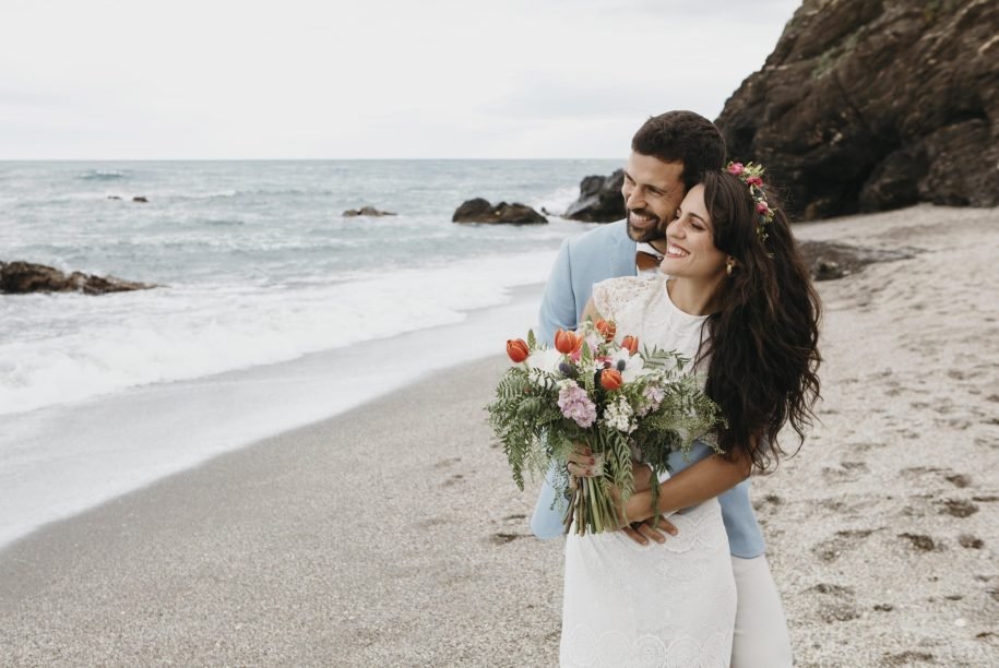 beautiful-husband-wife-posing-beach